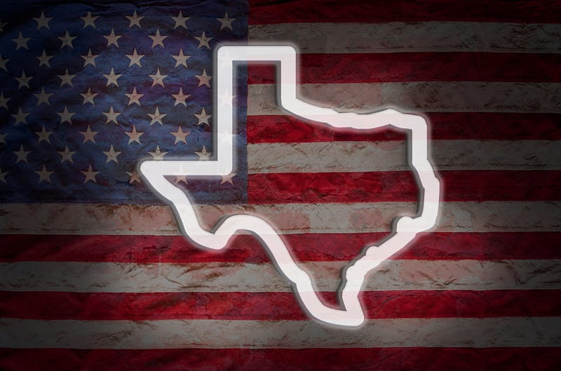 Photograph of a white outline of Texas over the United States flag - Pinnacle Forensics